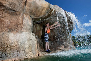 Kids playing in Breakers Lagoon waterfall