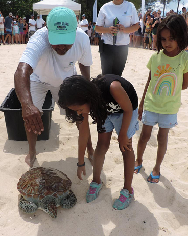 The Reading Family escort their turtle “Shelly” to the sea The Reading Family escort their turtle “Shelly” to the sea